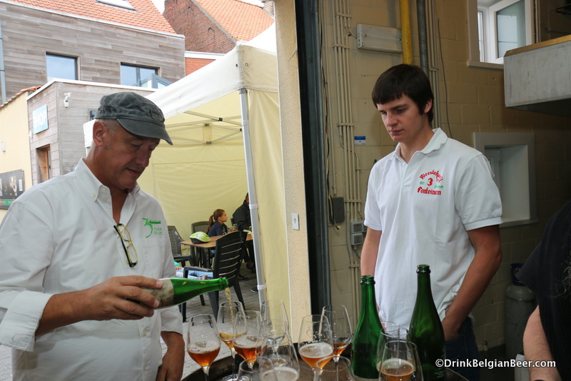 Armand Debelder, left, pouring a 3 Fonteinen Golden Blend as Michael Blancquaert looks on.