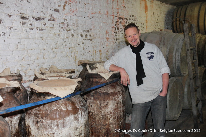 Jean Van Roy, brewmaster and blender of Brasserie Cantillon in Brussels, with some amphora in his brewery cellar. 
