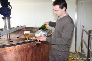 Photograph of Brasserie Dupont Moinette bottle glass copper brewkettle brehouse