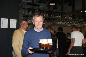 Photo of Professor Emeritus Freddy Delvaux. with De Kroon beers