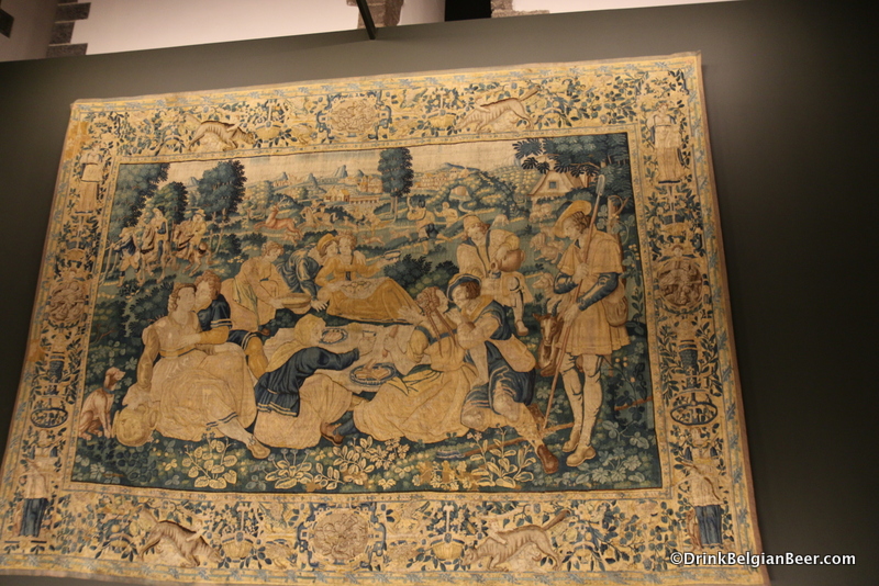 A tapestry in the museum of Oudenaarde. These folks were having some fun. Yes, it appears beer was involved. 
