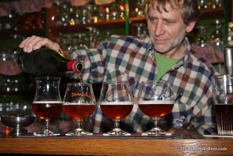 Hein pouring a 1970's or 80's Cantillon Kriek at De Gans in Huise, East Flanders, 2008.