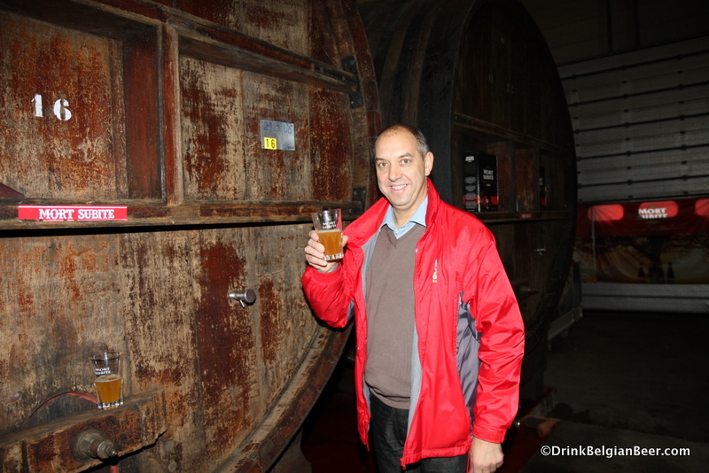 Bruno Reynders of Mort Subite with a glass of lambic from a foeder. 