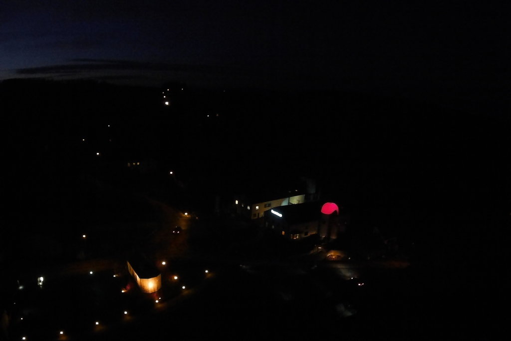 An aerial view of the Brasserie D' Achouffe complex at night. 