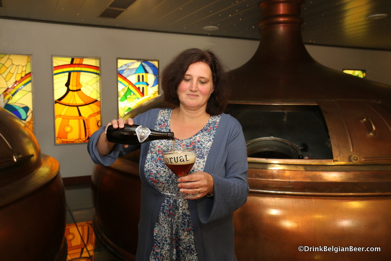 Anne-Françoise Pypaert, brewmaster, Brasserie d' Orval, pouring an Orval in the breewhouse. 