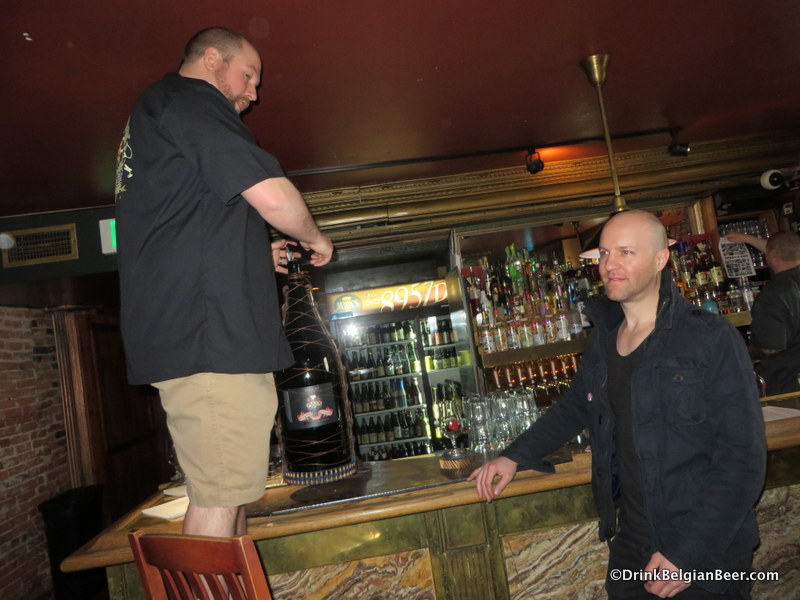 Casey Hard of Max's (left) opening 12 liters of Max's/Stillwater red-wine barrel aged Decade. 