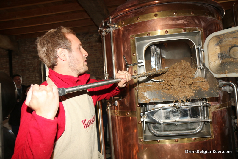 Another shot of Edward Martin removing spent grains from the mash tun.