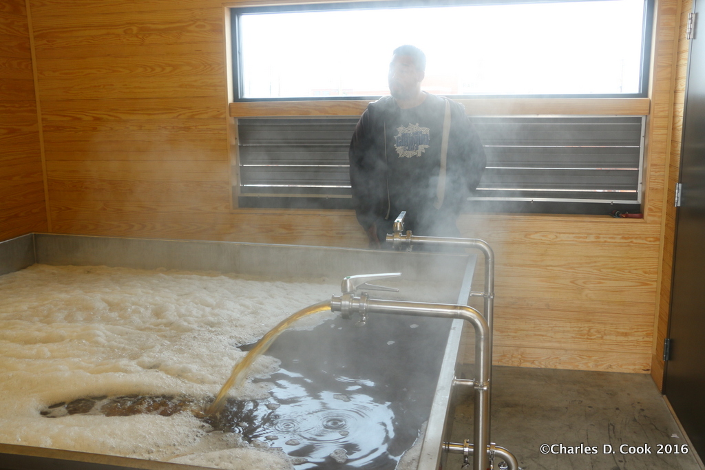Another shot of the coolship filling with wort at The Veil Brewing Company. 