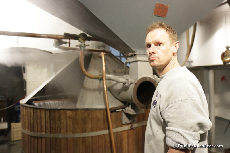 Brewmaster Jean Van Roy of Brasserie Cantillon, with his mash tun in action behind him.