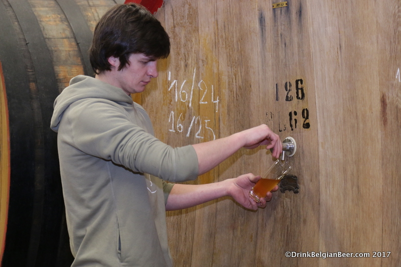 Michael Blanquaert pulling a sample of wort from a foeder at 3 Fonteinen's lambik-o-droom. 
