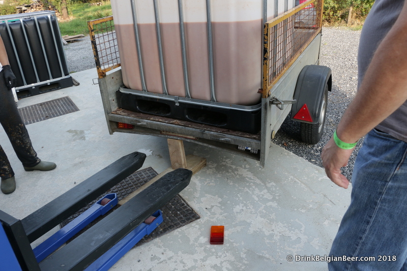 Preparing to unload the container of fruit slush. 