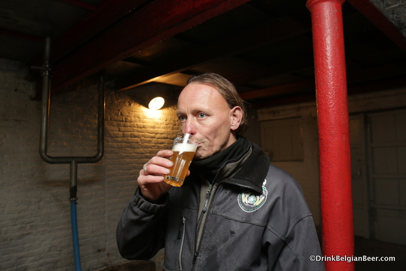 Brewer/ 7th generation owner Pauwel Raes, Brouwerij de Troch, tasting a glass of Oude Geuze. 