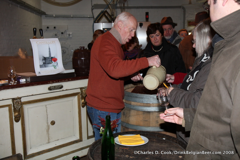 Jean-Pierre Van Roy pouring Cantillon lambic from a pitcher during Quintessence in 2008. Note the Grand Cru Bruoscella sign behind him. 