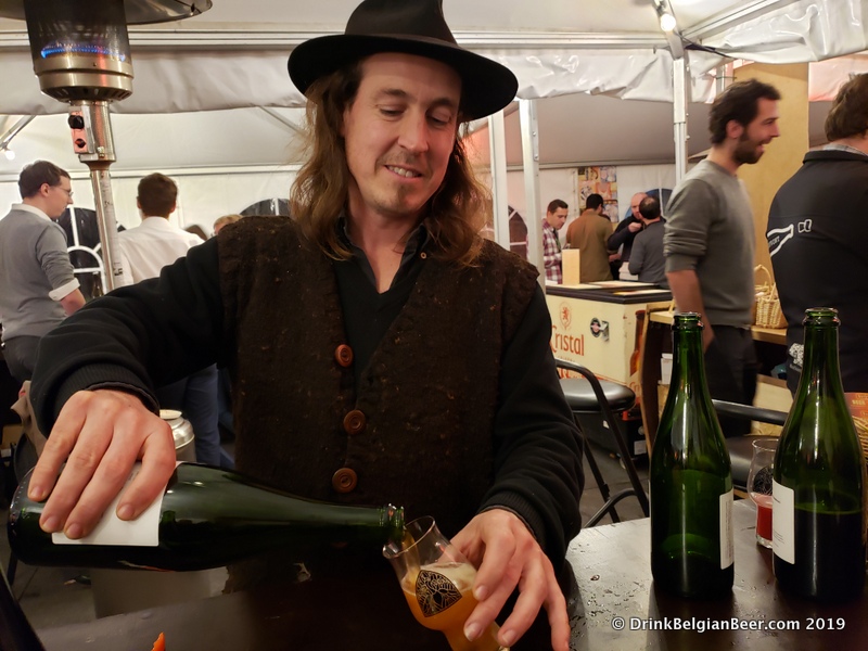 Tom Jacobs of Antidoot-Wilde Fermenten pouring a "Nacht van de Geit" at Gebrande Winning. This beer is described as an "International Gruit Ale" and was a collab with several other breweries. 
