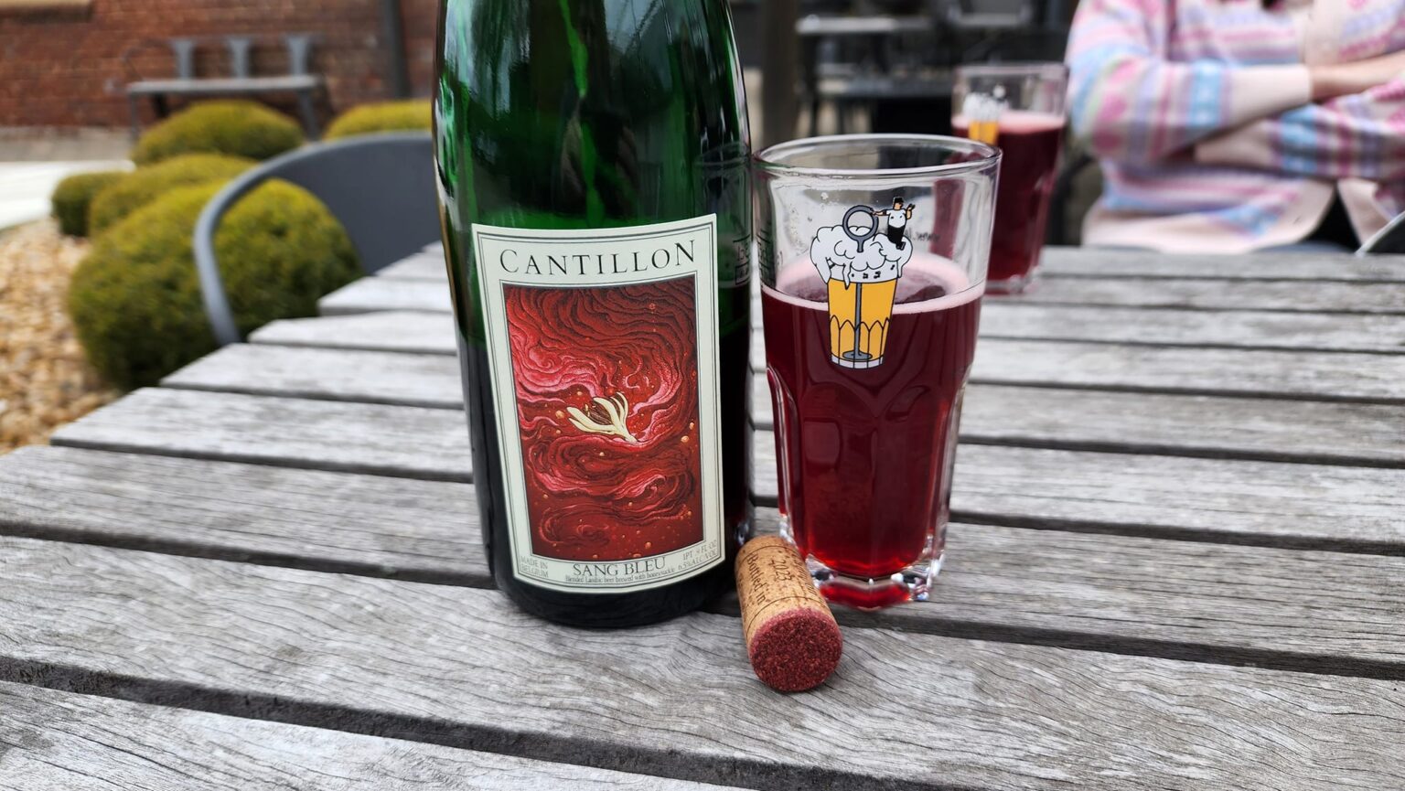 Cantillon-Sang-Bleu-2024-with-cork-in-beer-garden - Belgian Beer Specialist